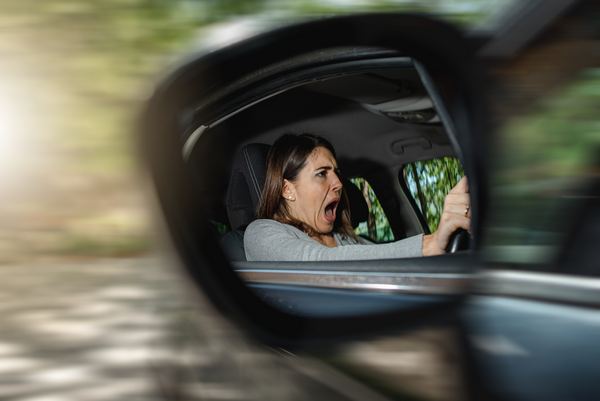 Caucasian female driver with a scared face during an accident